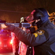 A police officer points a shotgun at protesters during a demonstration in Ferguson, Mo., Nov. 24, 2014.
Justin Sullivan/Getty Images